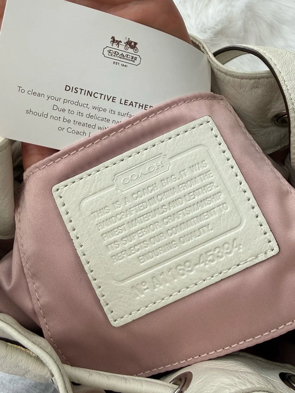 Coach Ivory Bucket Bag Drawstring Embossed Logo Adjustable Strap Pink Lining